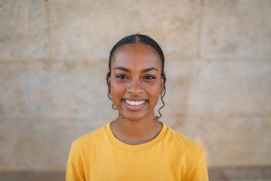 teenage black girl smiling outdoors