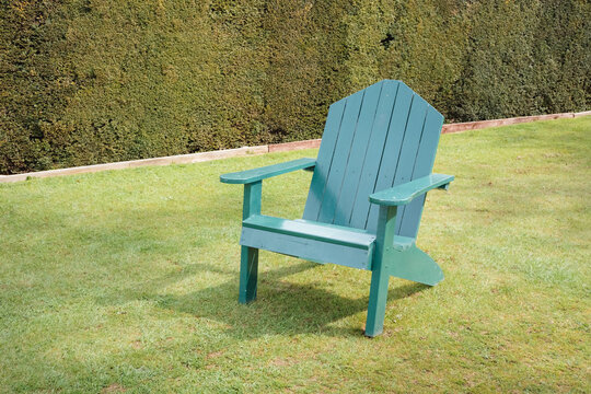 Green wooden chair in a garden