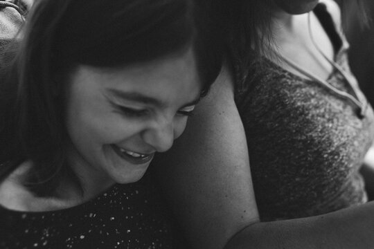Black and White photos of daughter snuggling up against her mother