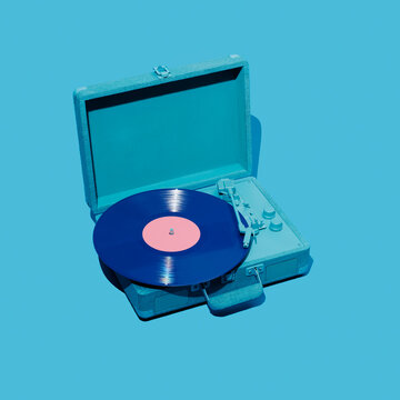 violet vinyl in a blue portable turntable