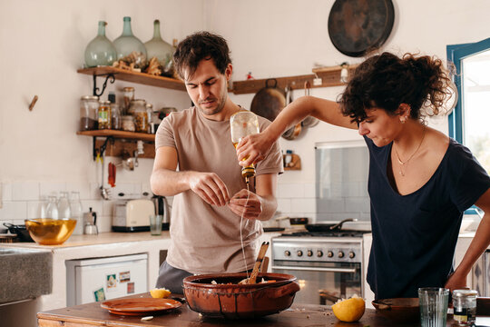 Couple cooking together in the kitchen