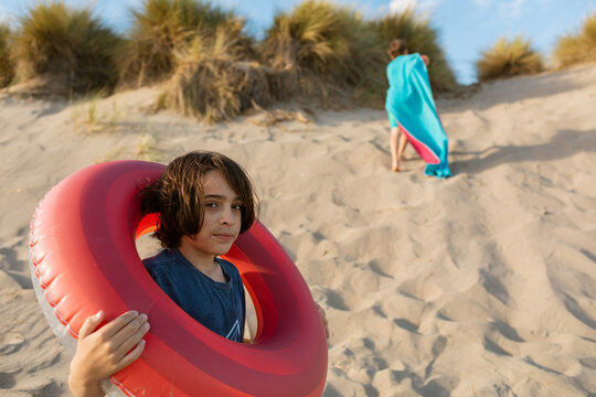 Kids enjoying at the beach - Powered by Adobe