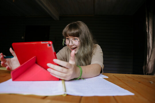 Cute teen girl during online education