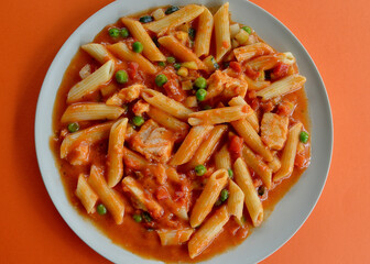 Chicken penne with vegetables in a creamy tomato sauce