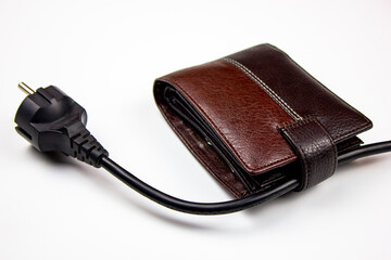 Electricity payment concept.Electric cable and wallet on a white isolated background.