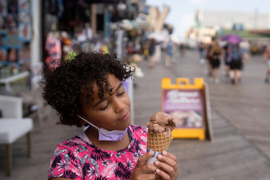 Girl enjoys chocolate icecream 