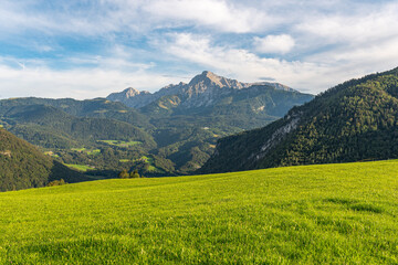 Fantastic view from an Alpine pasture in Ettenberg to the Göll massif, the Hoher Göll with its 2522m one of the highest mountains in the Berchtesgaden Alps. View to the Kehlsteinhaus, Eagles Nest