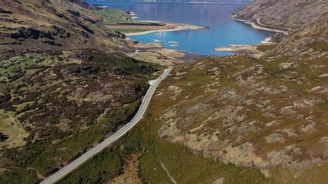 Lake Lake Hawea, New Zealand: Aerial drone footage of the stunning lake Hawea lookout on the road between Wanaka and Queenstown in New Zealand south island. Shot with a tilt up motion