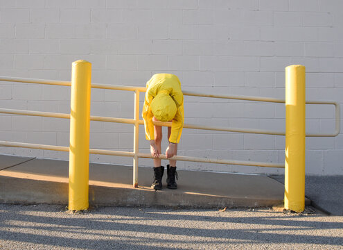 Bored Child in Raincoat Fed Up