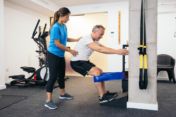 Physiotherapist working in a rehabilitation gym