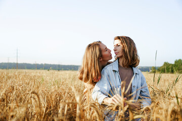lesbian couple in wheat field