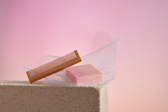 Comb made of wood and handmade soap made from natural