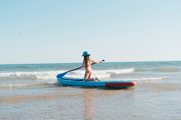 Little girl kayaking in the sea