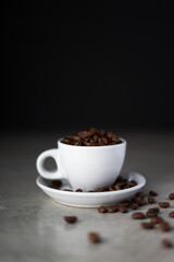 Cup of coffee beans on concrete counter top