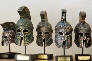 Tiny ancient greek helmets in souvenir shop in Chania, Crete, Greece