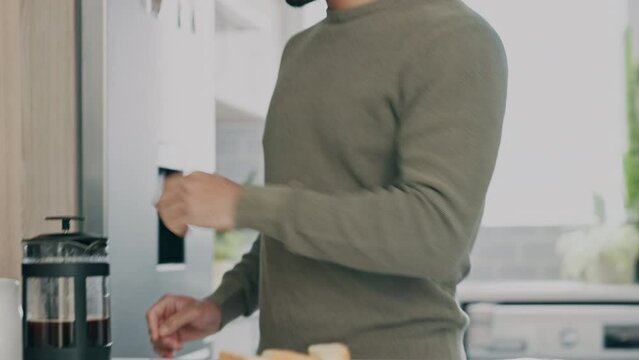 Morning, coffee and phone call businessman in kitchen networking on smartphone for remote work or work from home opportunity. Asian entrepreneur with breakfast and talking to client in online career