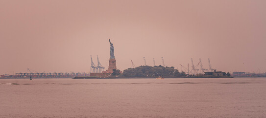 Fototapeta premium view of the statued of liberty in New York river usa 
