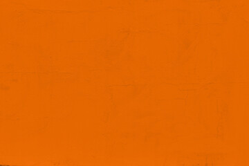 Saturated pastel orange colored low contrast Concrete textured background. Empty colourful wall texture with copy space for text overlay and mockups. 2023, 2024 color trend