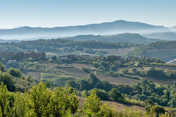 Panoramic view of the countryside of Todi, Perugia, Italy, partially shrouded in morning mist