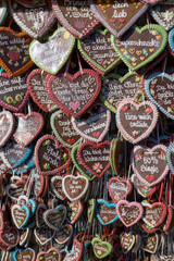 many gingerbread hearts with german text on it which says 