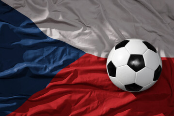 Fototapeta premium vintage football ball on the waveing national flag of czech republic background. 3D illustration