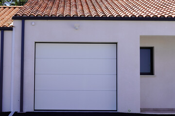 sectional modern home white gate portal and modern garage door of new house