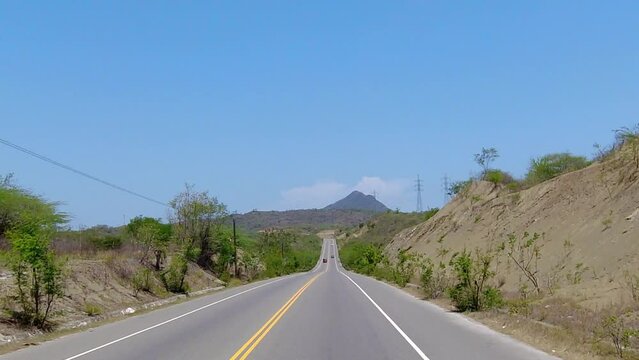 another shot of one of the main roads in the south of the dominican republic, entering a city called azua