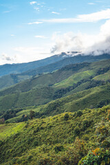 Fototapeta na wymiar Green mountain valley nan thailand,green mountain fields with blue sky
