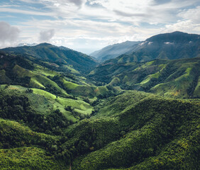 Obraz premium Green mountain valley nan thailand,green mountain fields with blue sky