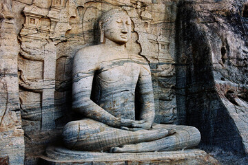 Fototapeta na wymiar Gal Viharaya and originally as the Uttararama, is a rock temple of the Buddha situated in the ancient city of Polonnaruwa in North Central Province, Sri Lanka.