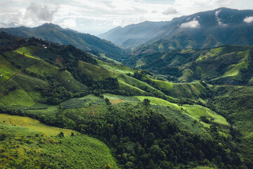 Fototapeta premium Green mountain valley nan thailand,green mountain fields with blue sky