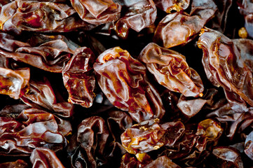 Close-up shot of freshly dried dark-colored raisins.