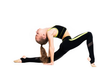 Flexible little girl gymnast in black sports gymnastic suit does acrobatic exercises isolated on a white background with space for text or logo. Sport, workout, fitness, yoga, active lifestyle concept