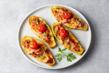Zucchini stuffed with meat, vegetables and cheese. Zucchini boats. Turkish name; kabak sandal