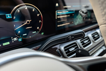 Fototapeta na wymiar Modern luxury car interior with steering wheel, multimedia and dashboard