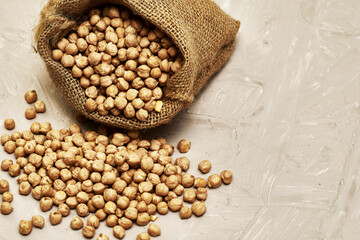 chickpeas in a canvas bag and scattered on the table