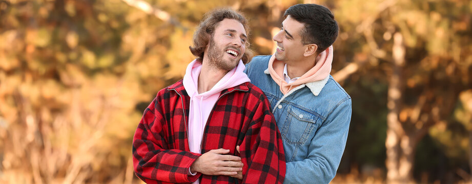 Happy Gay Couple In Park On Autumn Day