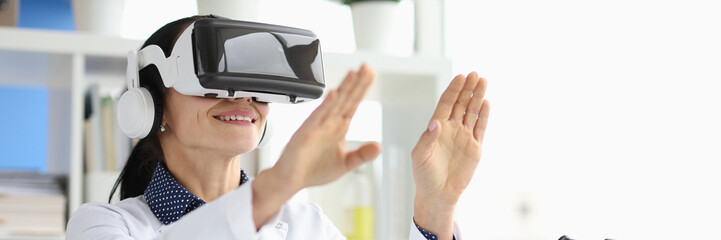 Doctor wearing virtual glasses in virtual reality in laboratory