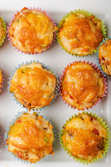 close up of cheesy savory muffins with vegetable 
