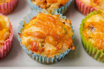 close up of cheesy savory muffins with vegetable 