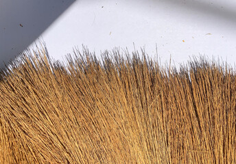 Close-up brown handmade straw broom texture