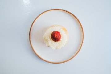 a tasty strawberry cake on plate in cafe and restaurant