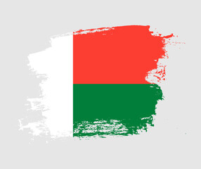 Artistic Madagascar national flag design on painted brush concept