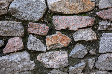 Stone wall with moss as background