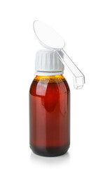 Bottle of cough syrup with spoon on white background