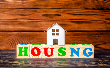 Wooden home and text on the cubes housing
