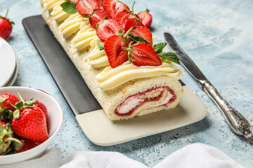 Plate with tasty strawberry roll cake on color background, closeup