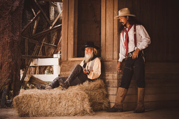 Cowboys group under conversation hand holding gun or rifle weapon ,this is vintage western...