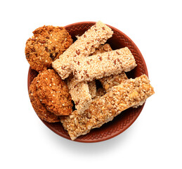 Bowl with tasty sesame kozinaki on white background