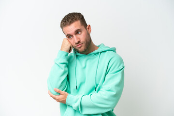 Young handsome caucasian man isolated on white background with tired and bored expression